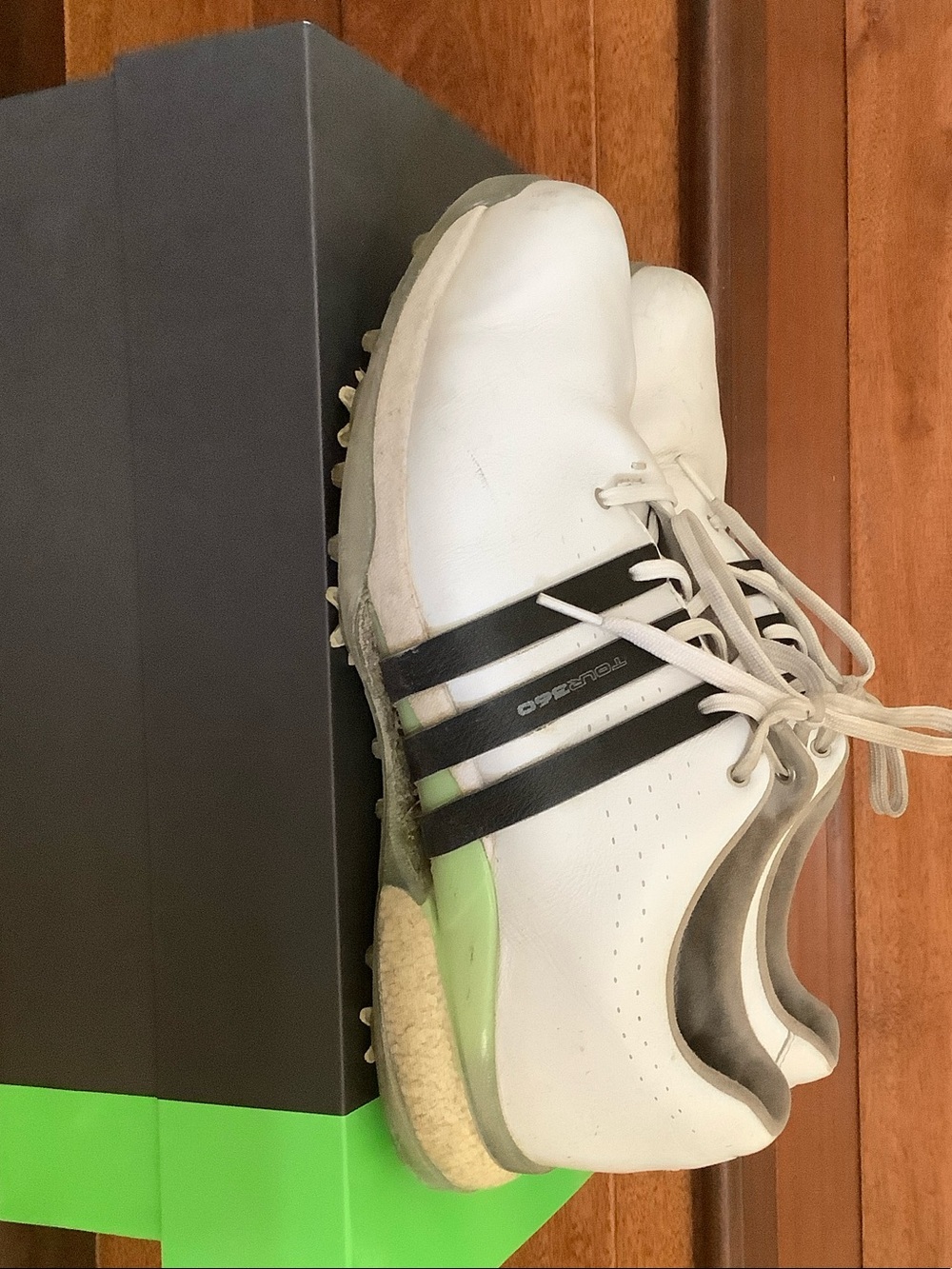 adidas White Golf Shoes with Black Stripes and Green Heel Accent